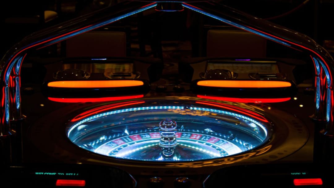 Roulette table at a casino lit up at night