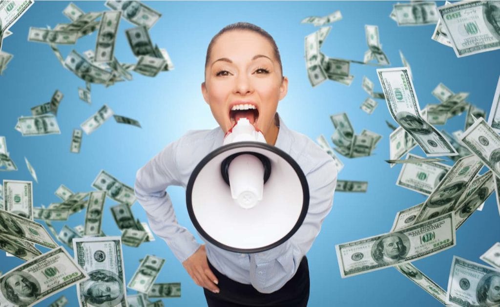 Businesswoman with megaphone and money rain falling against blue background