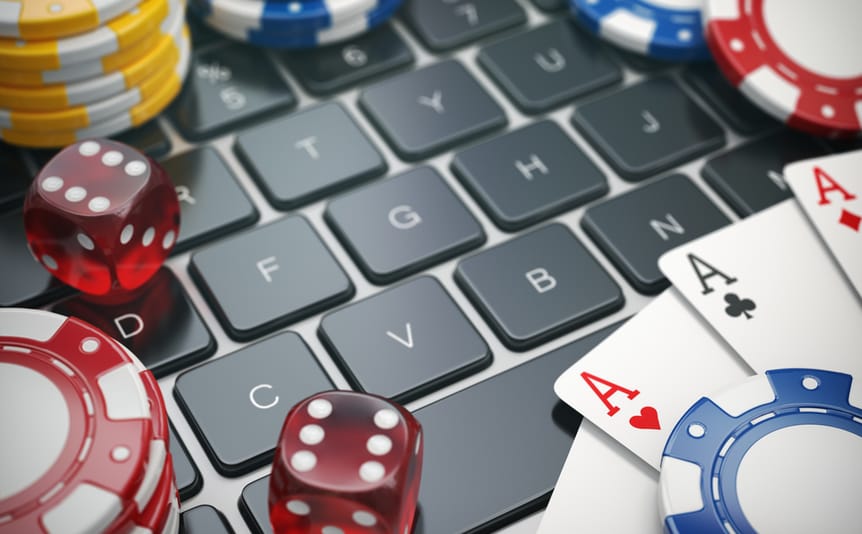cards and casino chips lying on a computer keyword