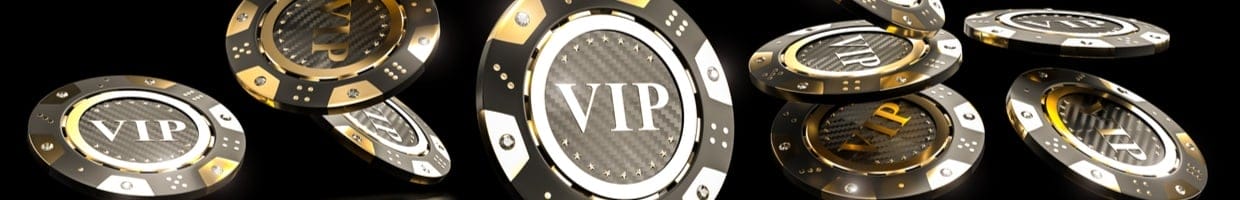 Casino chips with the word “VIP”, seen falling down as if scattered.
