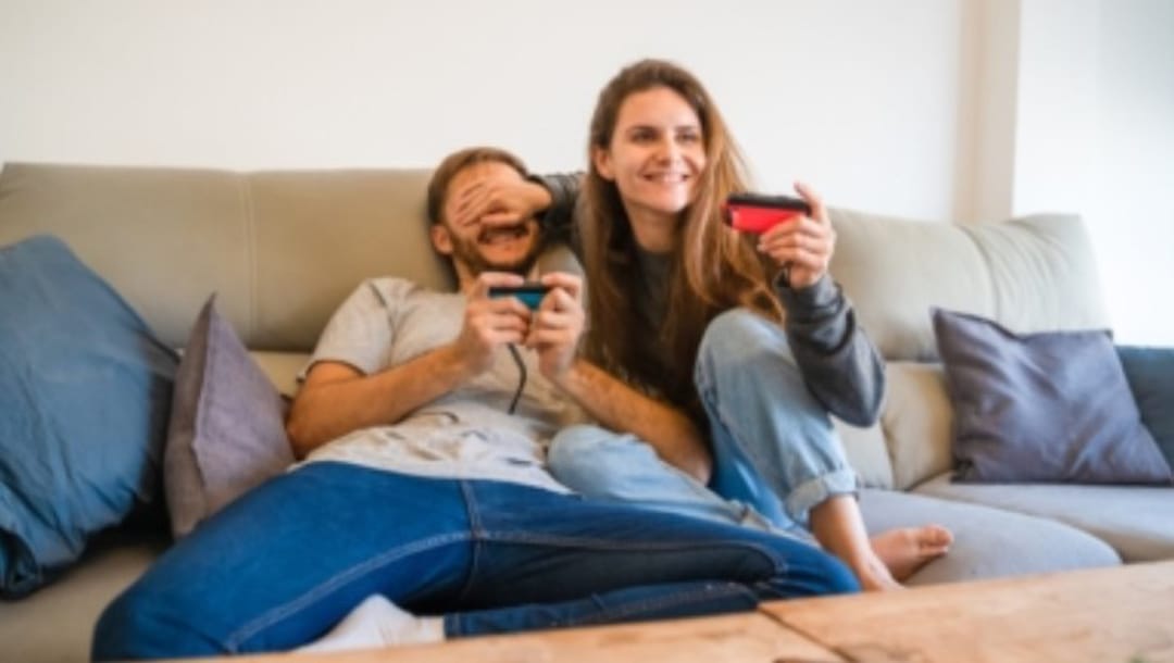 A couple is playing Nintendo