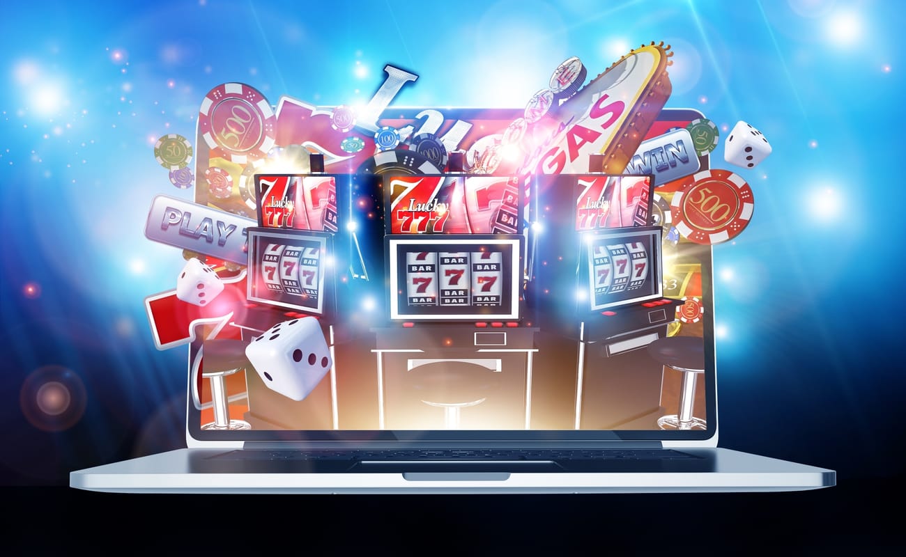Illustration showing online slots and gambling paraphernalia bursting out of the screen of a laptop computer.