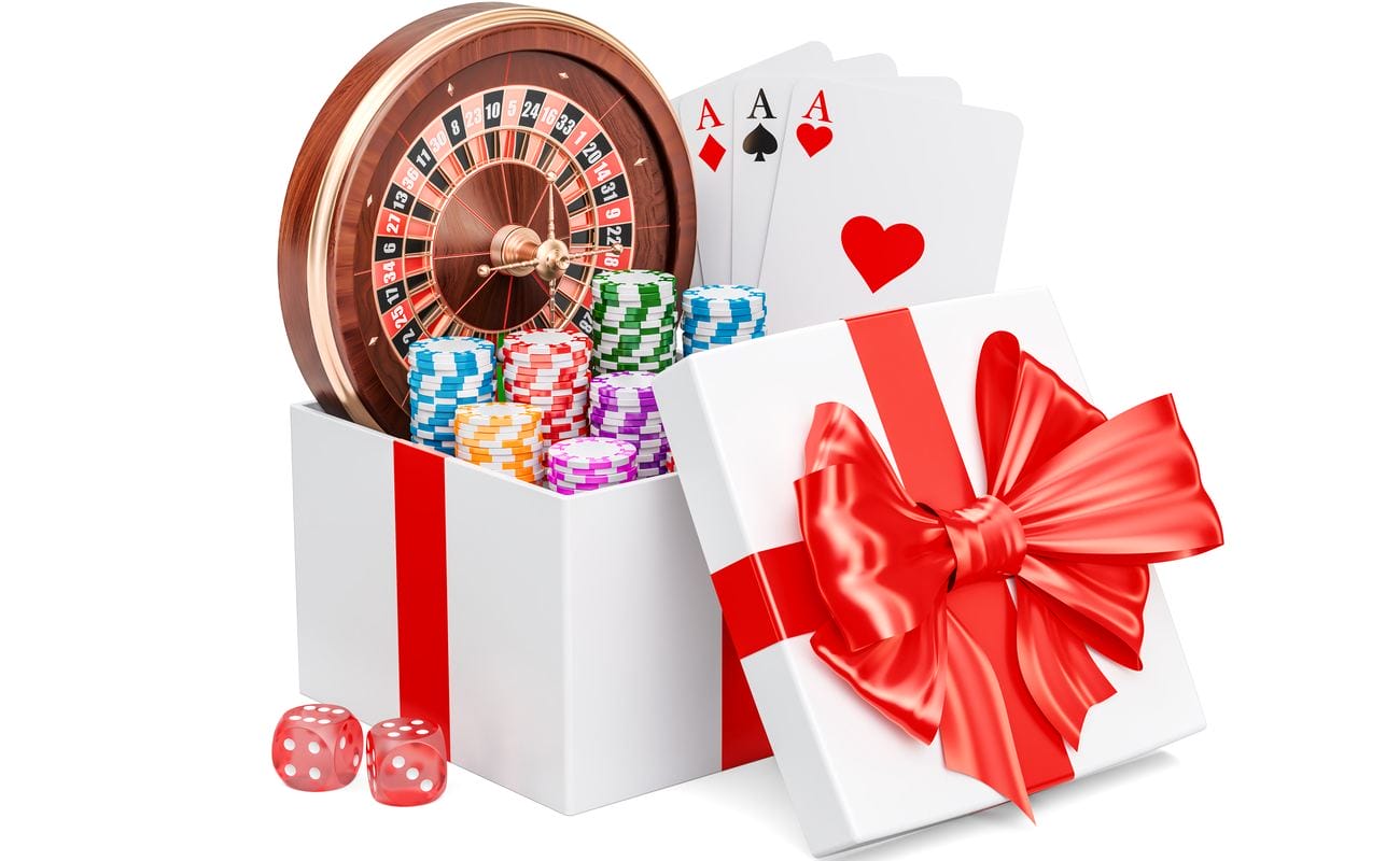 3D concept of a gift box full of casino-related presents including dice, chips, cards and a roulette wheel.