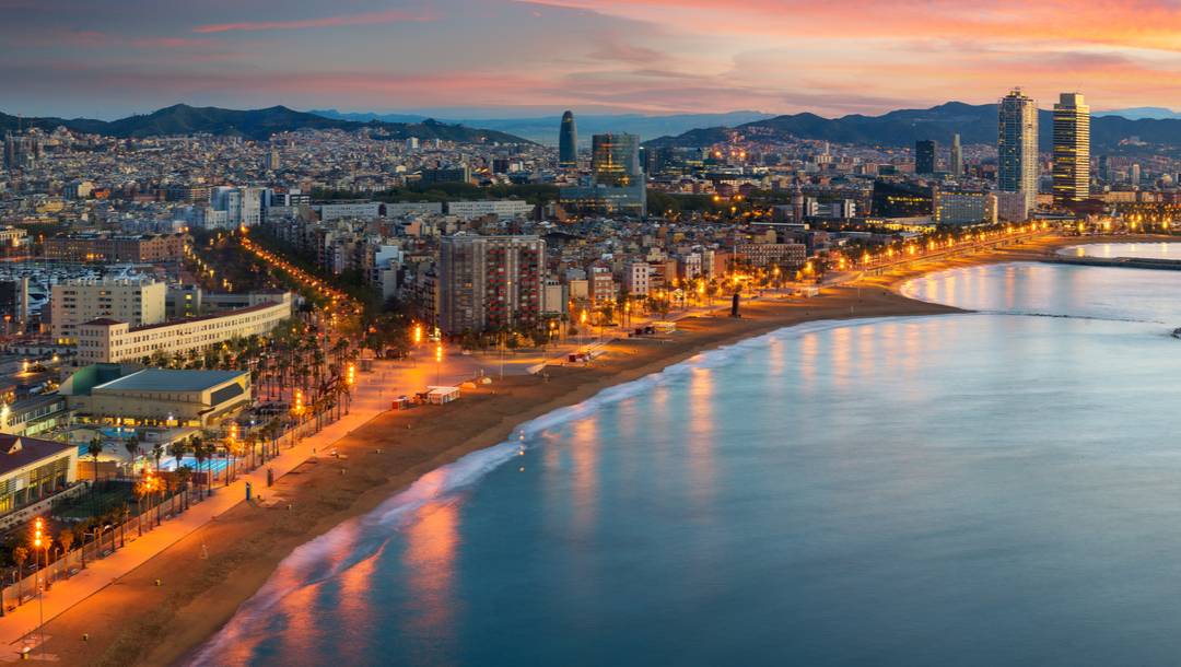 A beach in Barcelona, Spain, early in the morning.