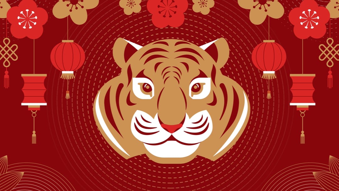 An illustration of a tiger on a red background with Chinese lanterns and flowers.