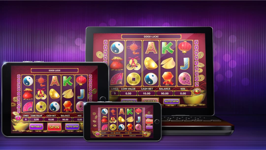 A phone, tablet and laptop showing reels with Asian-themed symbols like yin and yang, and lanterns on a purple background.