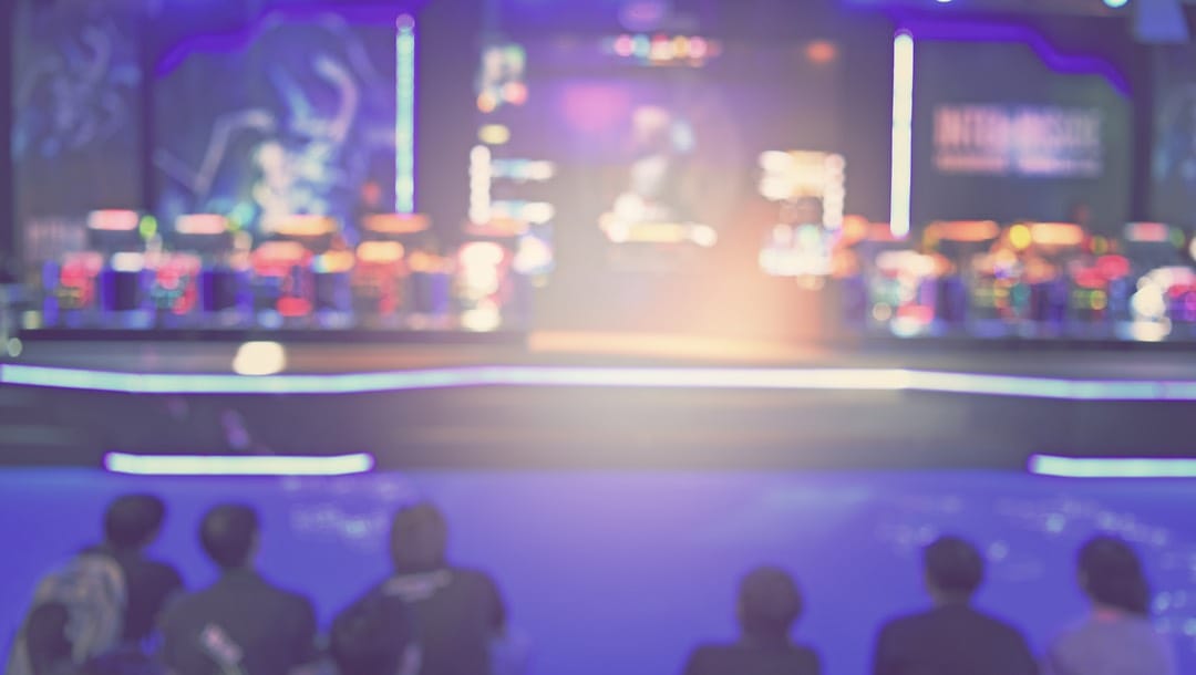 Blurred view from the audience of a game show stage.