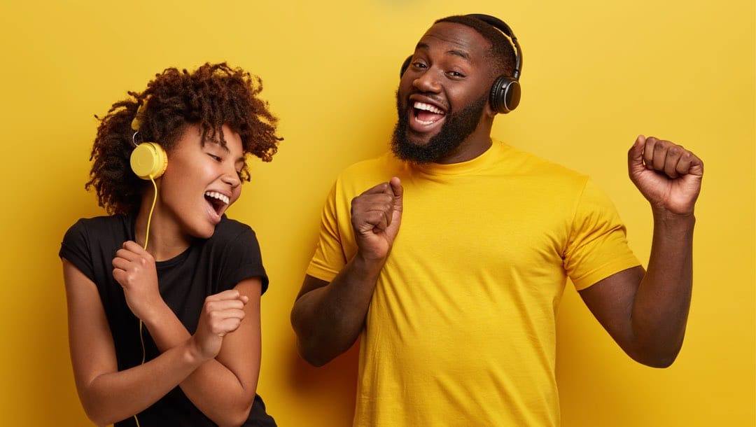 Two people dancing against a yellow background.