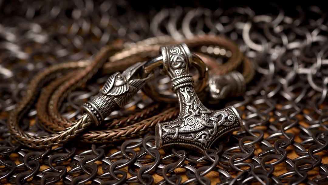 Necklace of Thor's silver hammer pendant on a chain.