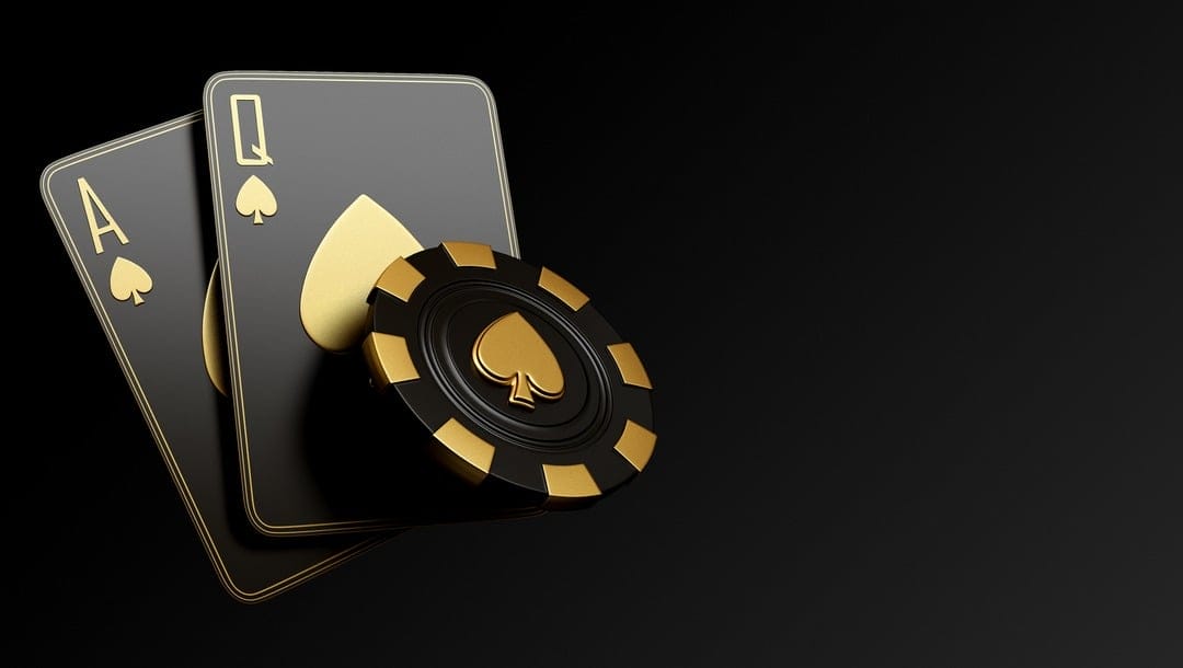 An ace, queen and a poker chip in black and gold colors.