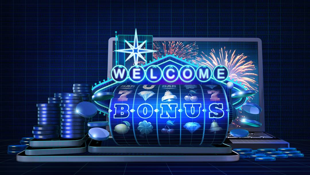 An illustration of a virtual slot reel with the words “Welcome bonus.” It sits on top of mobile devices and in front of a laptop. There are stacks of casino chips on the left.