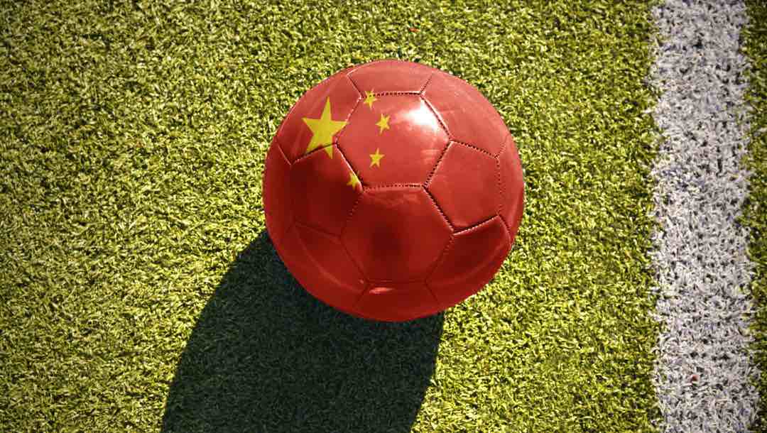 Top view of a soccer ball with the Chinese flag painted on it.