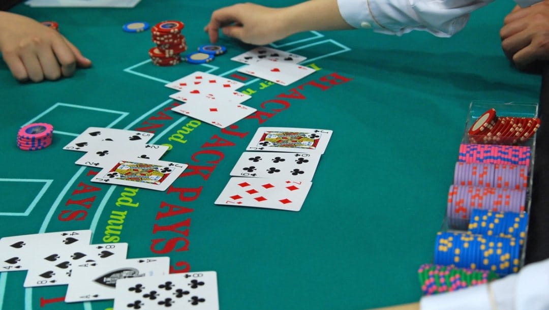 blackjack dealer interacting with a player during a game.