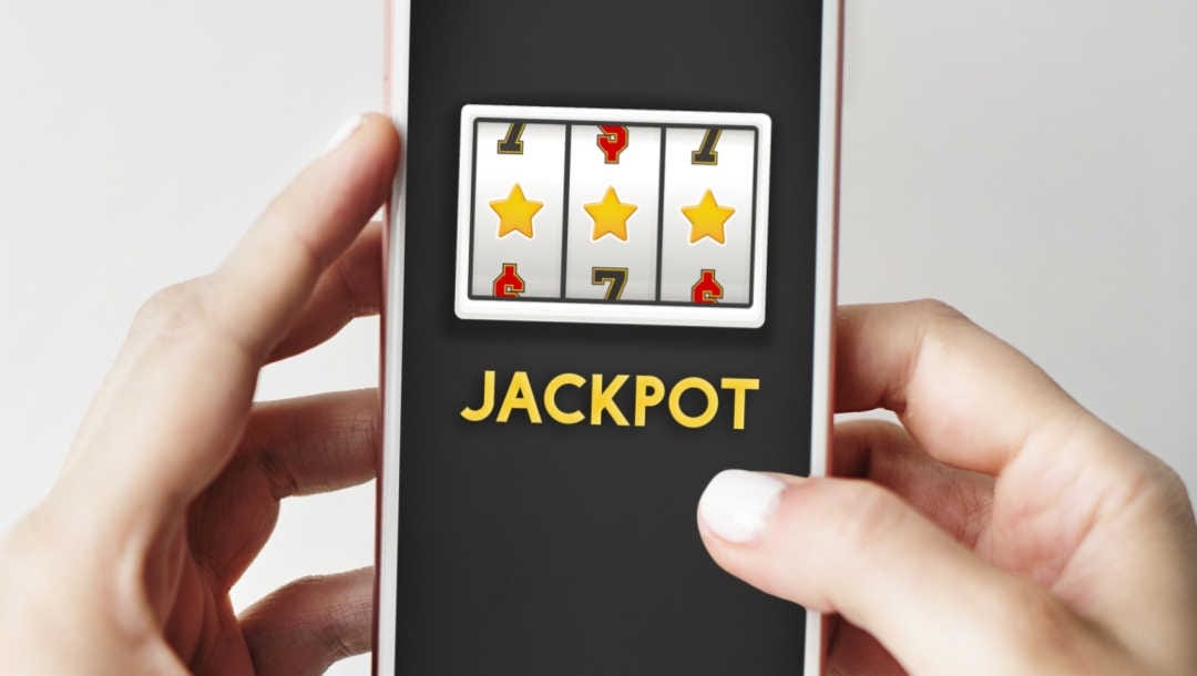 A person wins a jackpot on online slots on their smartphone.