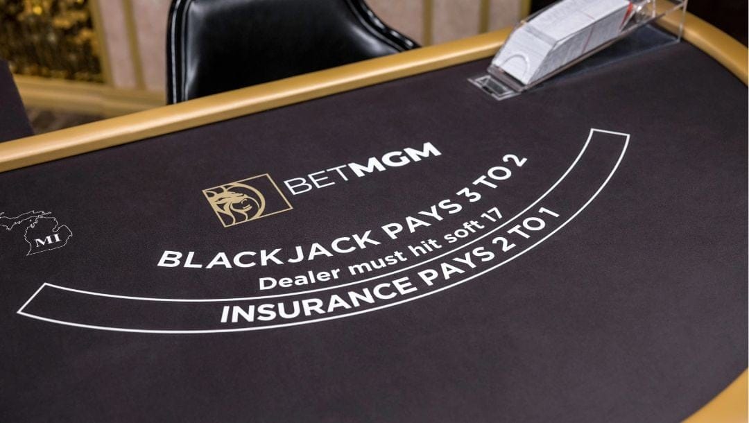 A black BetMGM blackjack table in a casino setting.