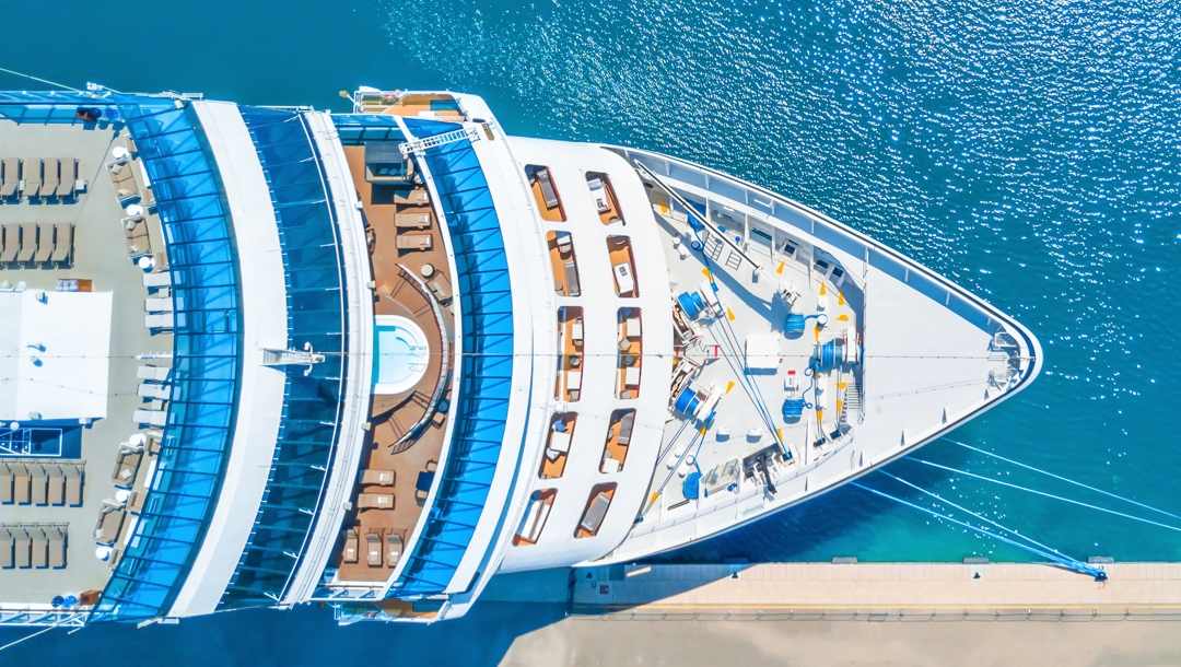 An aerial view of a docked cruise ship.