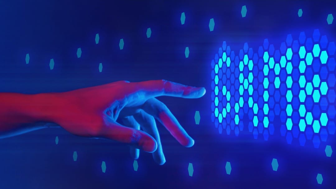 A hand reaching for a blue game screen.