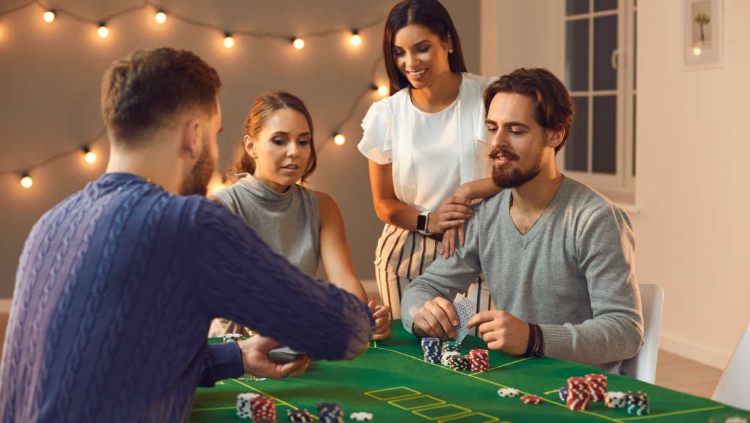 A group of friends playing poker together at home