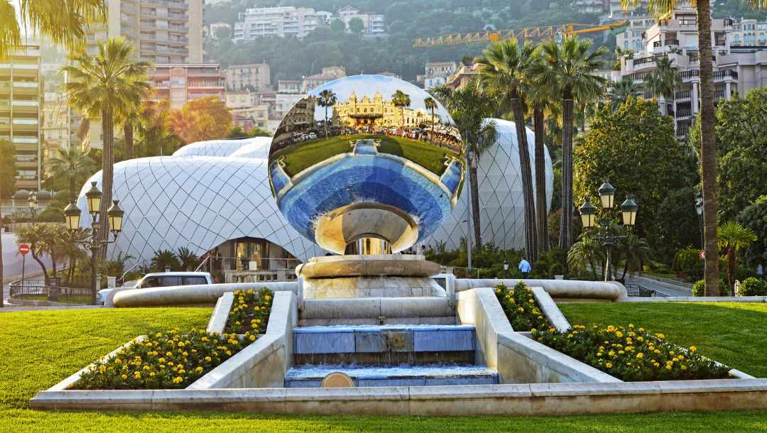 large mirror sphere reflecting the Monte Carlo Grand Casino in Monaco