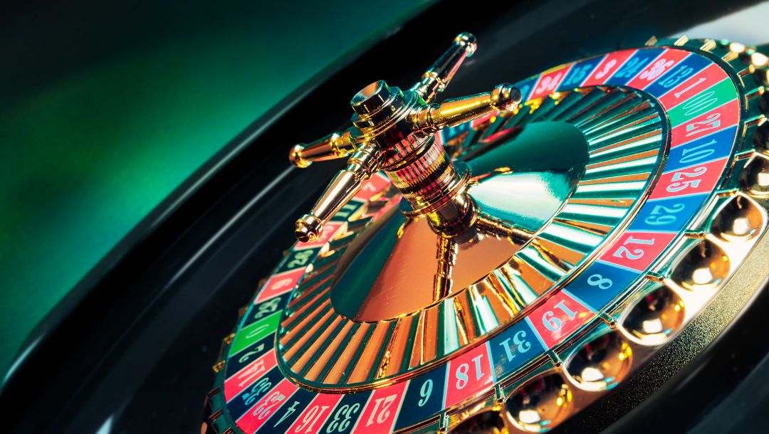 close up high contrast image of a roulette wheel in a casino
