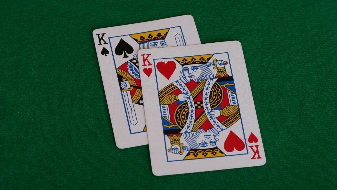 pocket kings on a green felt poker surface