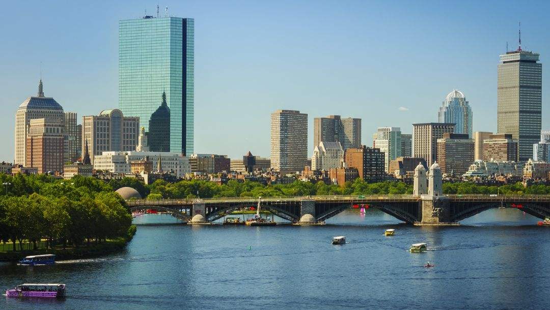 the Boston, Massachusetts skyline across the Charles River on a sunny summer day