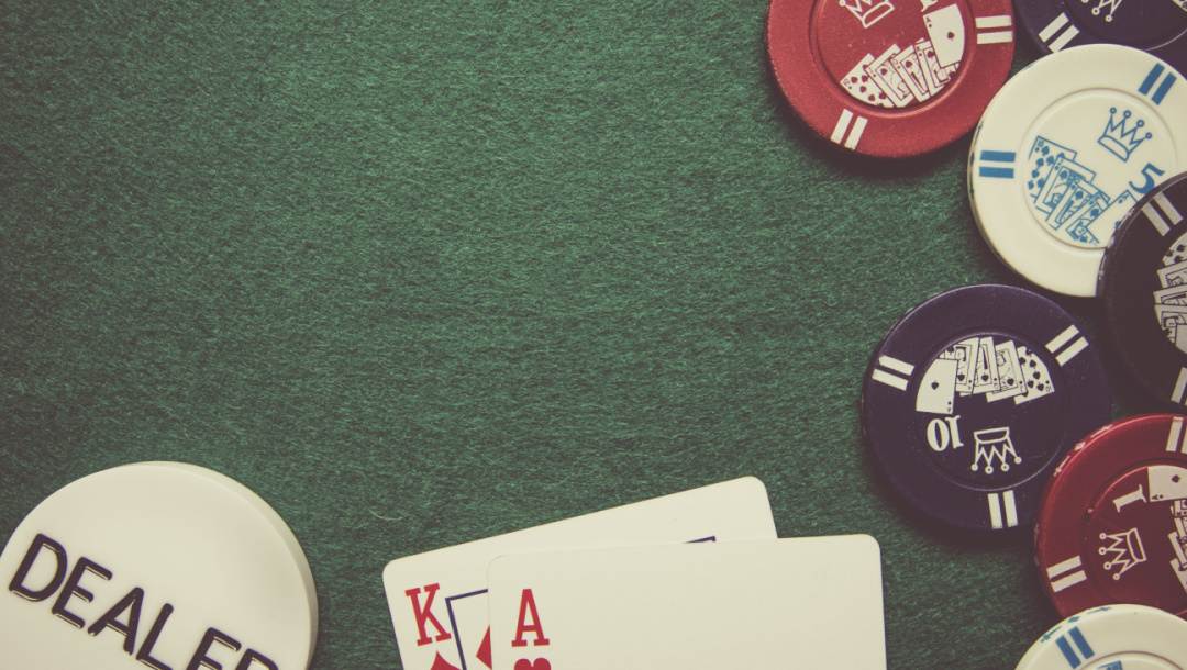Playing cards and chips on a poker table.