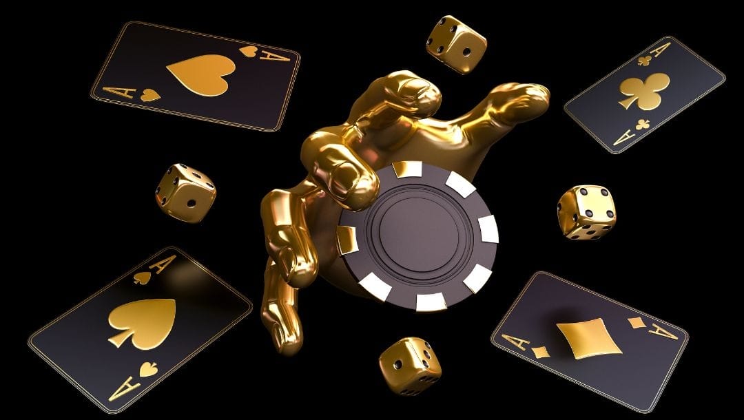 A golden hand reaching out of a black background to grab a black and gold poker chip with four gold, six-sided dice and an Ace playing card of each suit surrounding it.