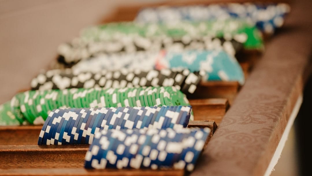 poker chips stacked next to each other on a table