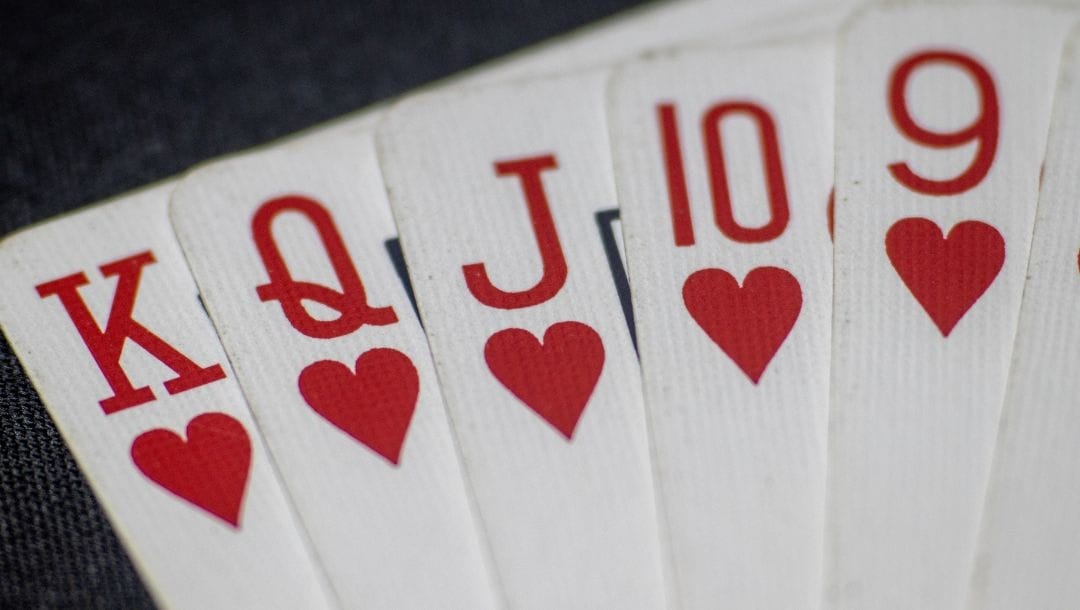 a close up of a straight flush of hearts