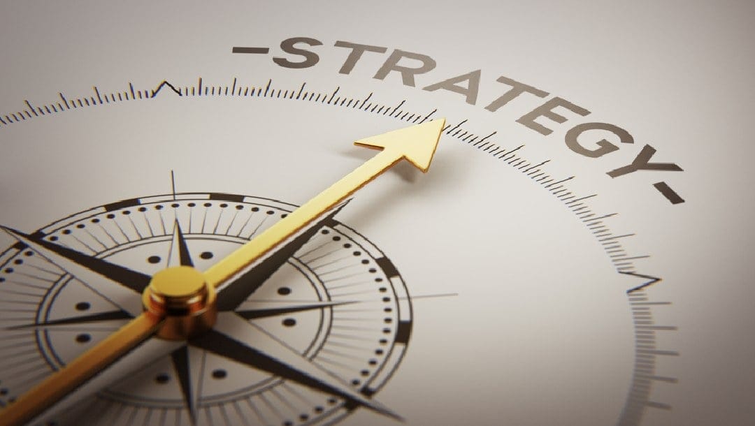 A compass arrow pointing to the word “strategy.”