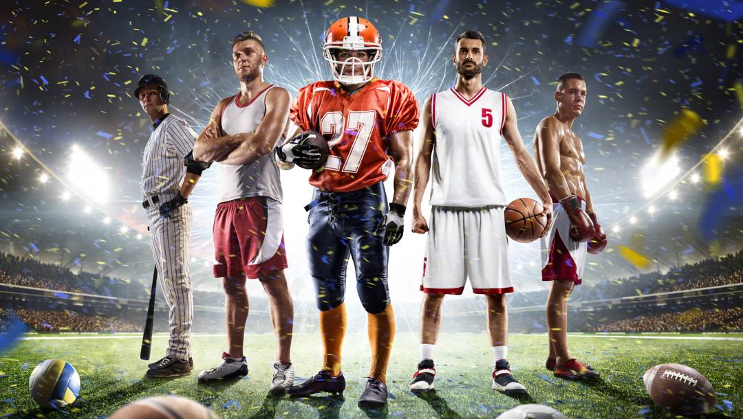 Five sportsmen standing in a stadium with a bright light behind them. These athletes are a baseball player, a runner, an American football player, a basketball player, and a boxer.