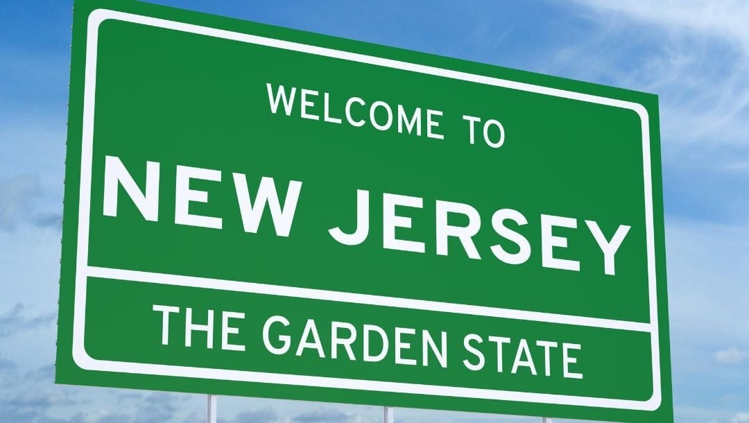 A concept of a green road sign that reads, “Welcome to New Jersey. The Garden State.”