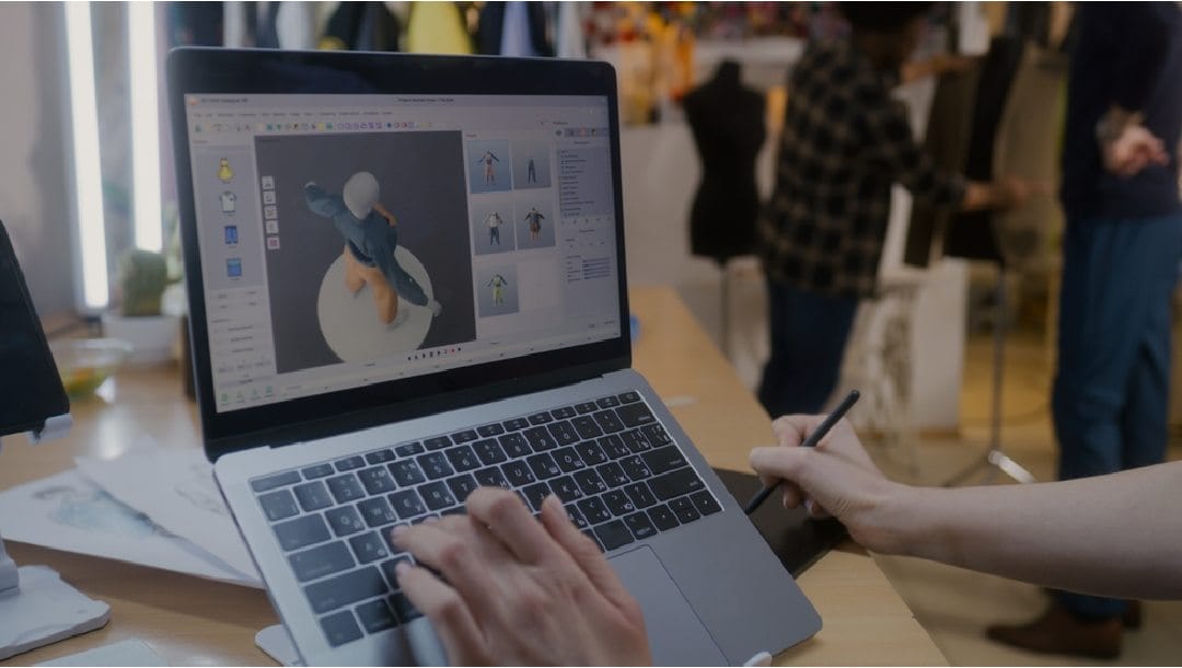 A fashion designer working on a laptop.