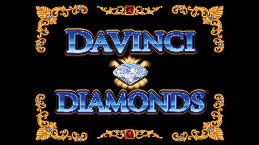 The title screen of the Da Vinci Diamonds slot game, featuring the game’s title surrounded by detailed golden designs framing the picture. A large diamond sits in the center of the image.