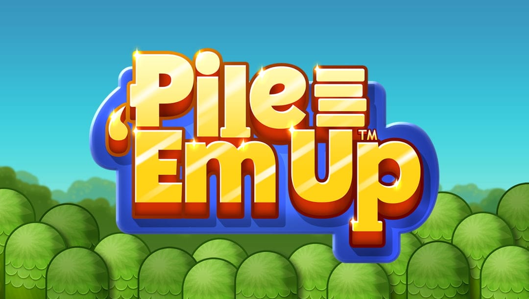 The title screen of the Pile ‘Em Up slot game. The game title, spelled out in gold letters, appears in the center of the screen with a blue outline. This logo appears on a simple background made up of cartoon trees and a bright blue sky.