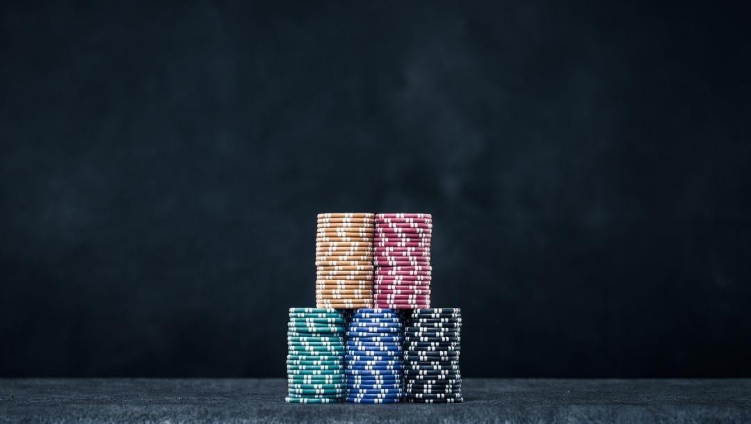 Stacks of poker chips neatly piled on top of each other.