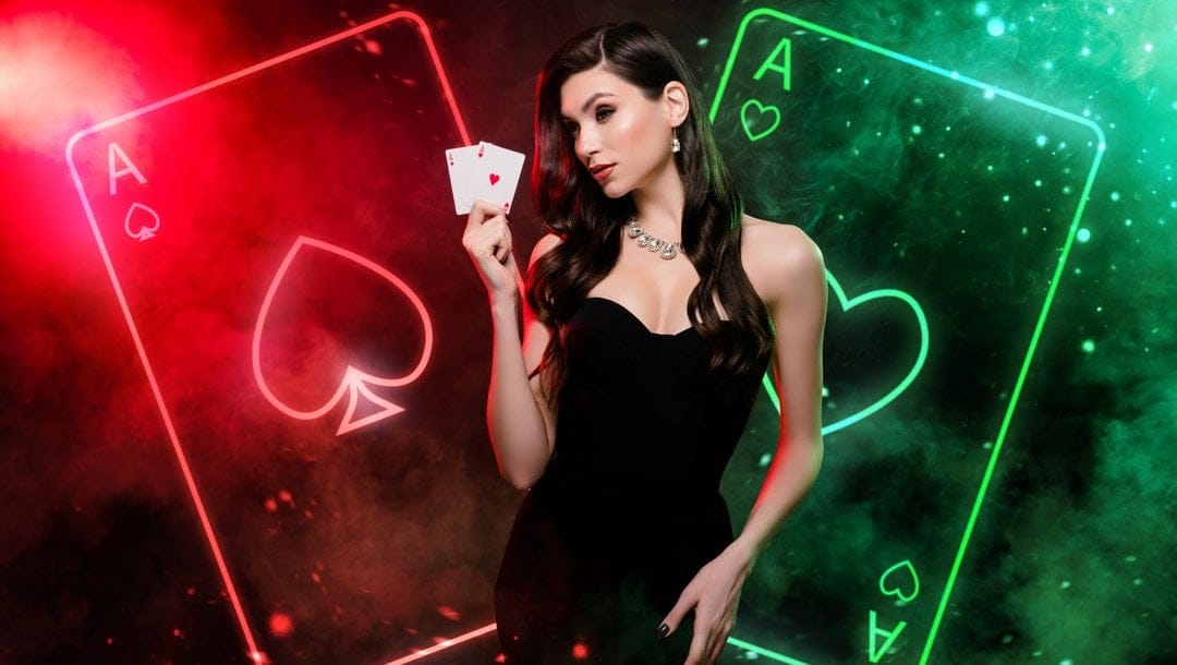 A person wearing a black dress and holding up two aces. Behind them is a neon red and green outline of two aces.