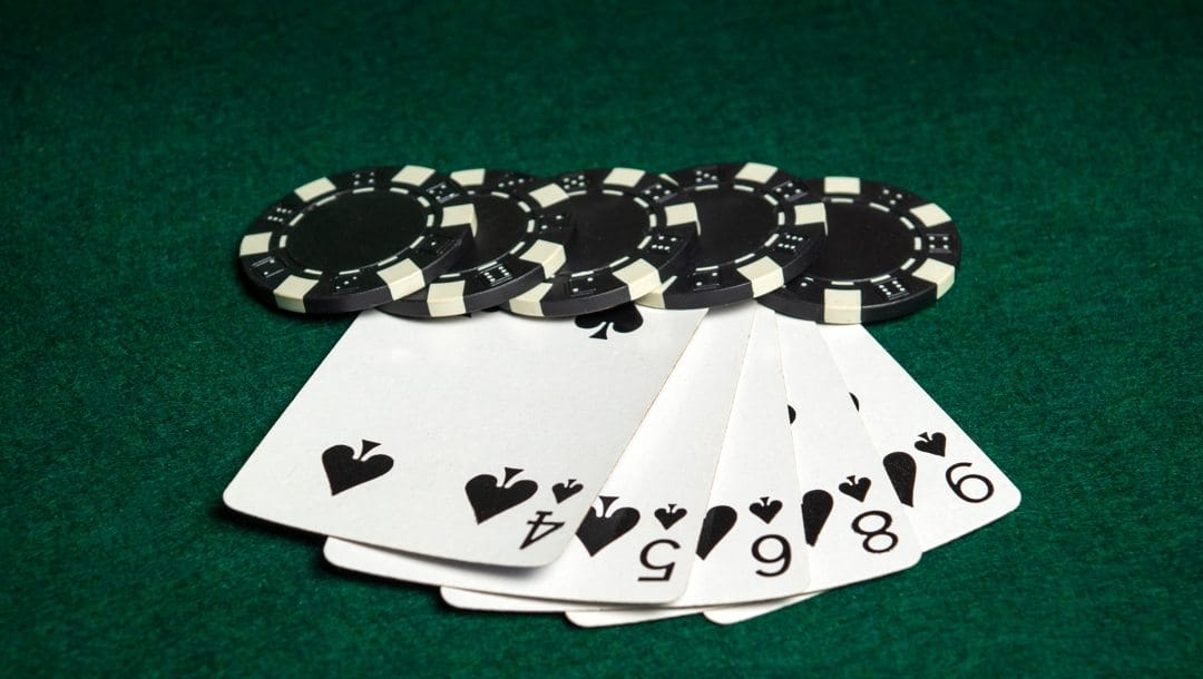 Cards and poker chips on poker table