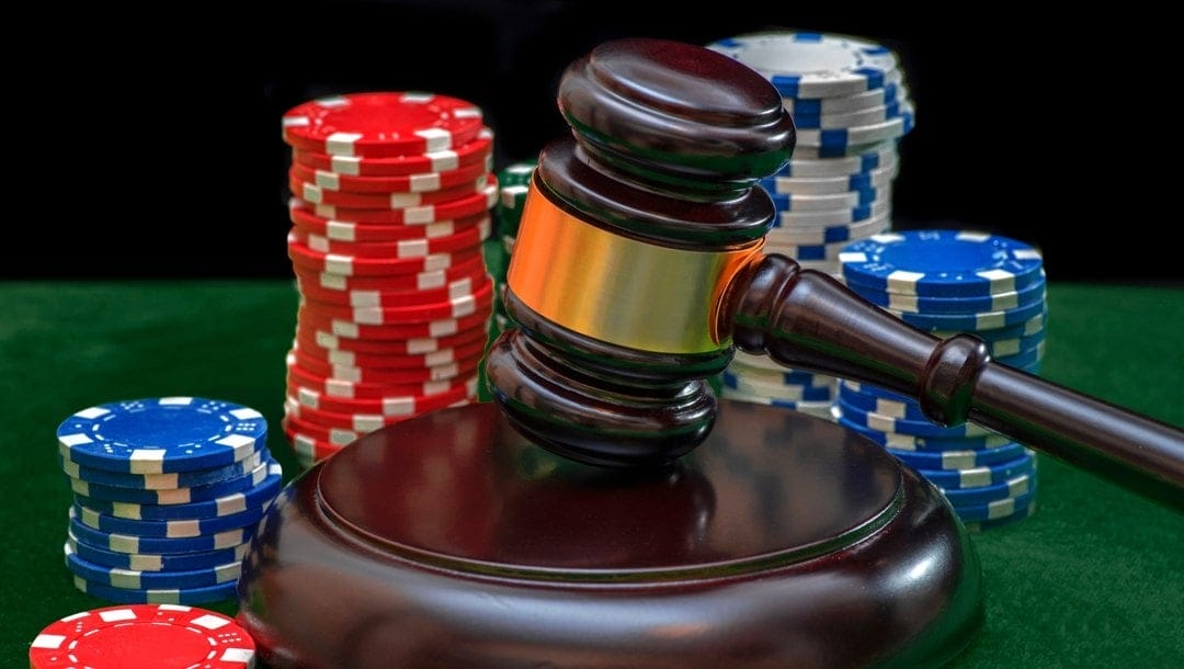Judicial gavel and casino chips.