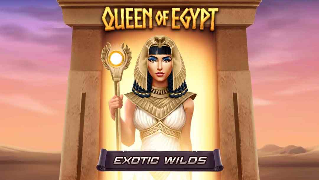 In the title screen for Queen of Egypt Exotic Wilds, Cleopatra stands under an ancient structure with the desert in the background.