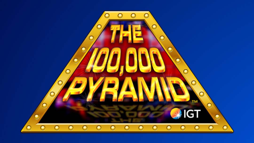 The title screen of The 100,000 Pyramid by IGT. A golden pyramid with bright lights surrounds the game’s name and IGT logo. The pyramid is set against a blue background.
