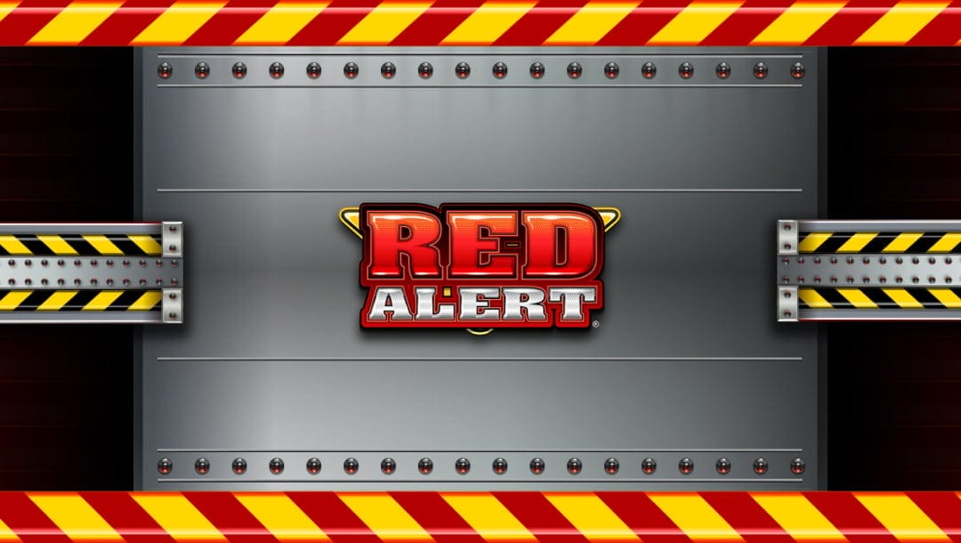 The Red Alert slot title screen, featuring a silver vault with the game logo in the center, with bright red and yellow designs framing the image.