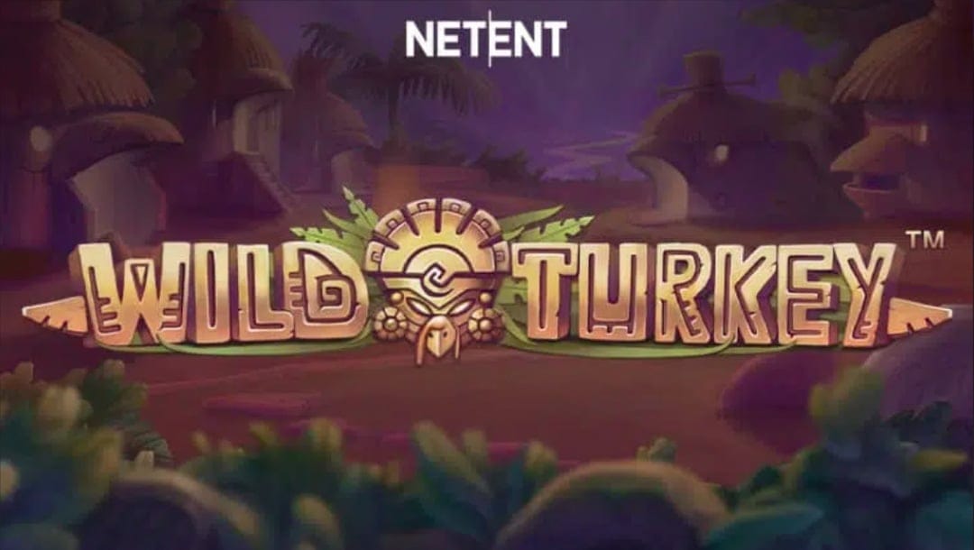 Wild Turkey online slot title in brown and gold. The background is set at night with palm trees and hut houses against a purple night sky.