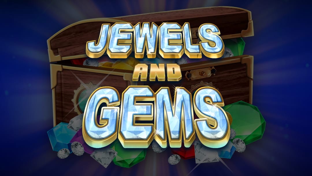 Jewels and Gems online slot in silver an gold. The background contains a treasure box with colorful jewels and gems. Behind the treasure chest is a blue bold background.