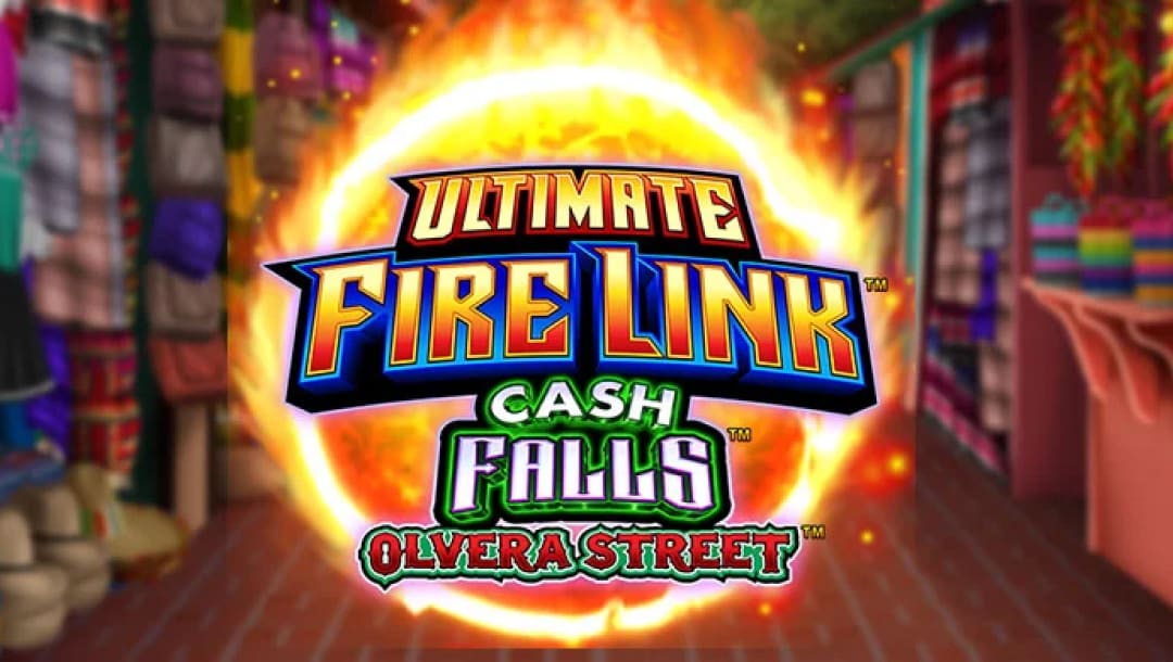 Ultimate Fire Link Cash Falls Olvera Street online slot logo. The logo is in blue, orange, white, green and red against a giant fireball. The background shows a Mexican store and it is blurred.