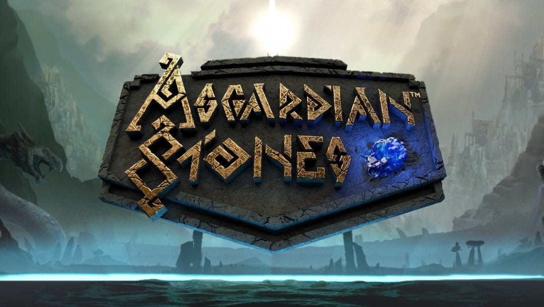 The title screen for Asgardian Stones, featuring the game title written in stone on a dark stone slab with Asgard in the background.