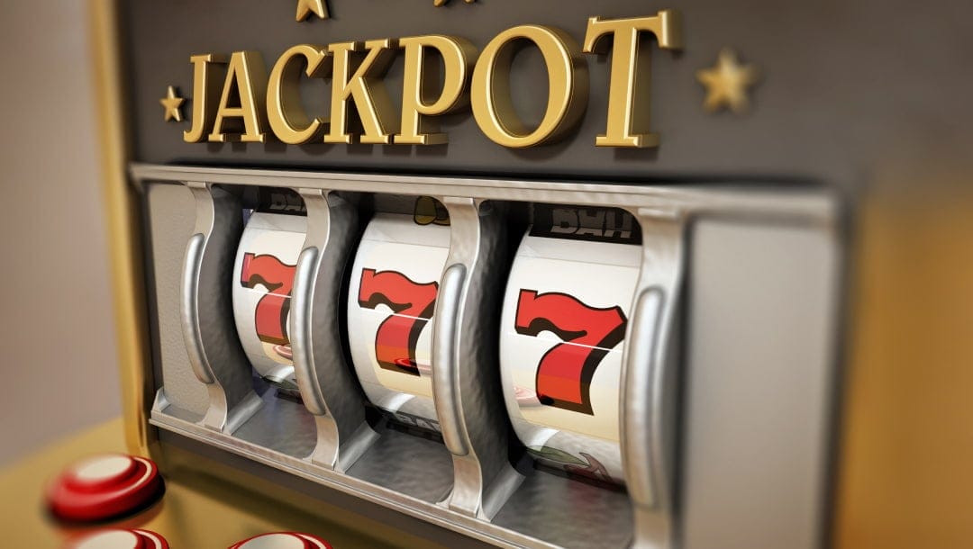 Close-up of a classic slot machine showing a winning combination of three red sevens on the reels, with the word 'JACKPOT' displayed prominently above in gold lettering. The machine has a sleek silver and gold design with red buttons on the front.