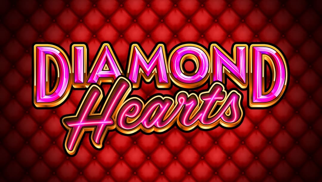 The Diamond Hearts title screen. The background is a red velvet cushion surrounded by an elegant golden frame. In the foreground is the title Diamond Hearts in a pink font set against a diamond heart with a golden frame.