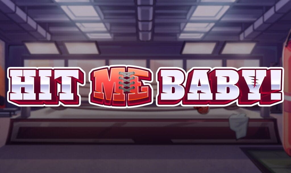 The Hit ME Baby! online slot game banner featuring the game logo with a boxing gym in the background.